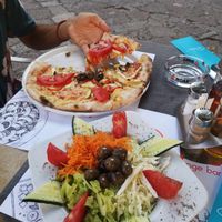 Vegan pizza y salad at Ombra Restaurant in Kotor