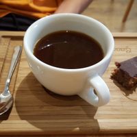 american coffee and vegan desert at Madal Food in Budapest