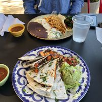 Sweet potato and black bean vegan quesadilla.  Food across the table is Ranchero taco. at Taco Ocho in Frisco
