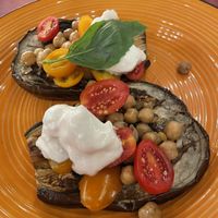 Roasted aubergine with chickpeas, tomatoes and a vegan cheese.  at L'OV Osteria Vegetariana in Florence