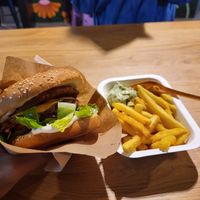 Smash burger and fries with sauce. at Veg Machine in Tallinn