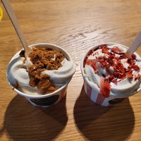 Oatly soft serve ice cream. Cookie crumbs on left and strawberry on right. at Veg Machine in Tallinn