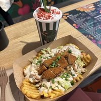 Loaded fries with chickn tenders + strawberry milkshake 💚  at Veg Machine in Tallinn