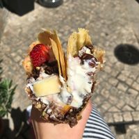 The goods in the Lindsay: fruit (apples, strawberries), vegan yogurt (tasted like a plain, unsweetened soy yogurt), chocolate granola with hazelnuts, sunflower seeds, and oats, and a drizzle of agave; served in a vegan, GF crepe.  INCREDIBLE COMBINATION!!!  at Sama Sama Catering in Lisbon