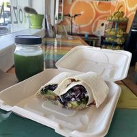 Chickpea wrap with avocado and part of the interior in background  at Mason Bar in New Smyrna Beach
