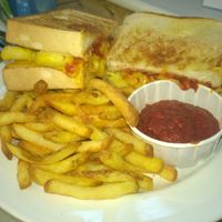 Mac 'n' cheese pizza sandwich with fries and dip at Grumpy Panda Slice Shop & Deli in Gateshead