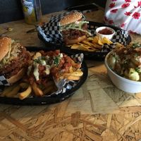 Burgers with dirty fries and mac and cheeze at Grumpy Panda Slice Shop & Deli in Gateshead