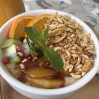 Coconut oat porridge with caramelized fruit and nut granola  at The Juicery Cafe in Pokhara