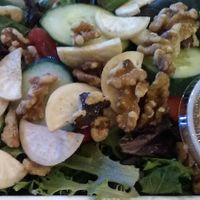"Totally 'Radishing'" salad special featuring local radishes and ordered with a healthy substitution of regular walnuts for candied. August 2020. at Taste Budd's Cafe in Red Hook