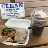 Vegan veg wrap and oat milk iced coffee at Taste Budd's Cafe in Red Hook