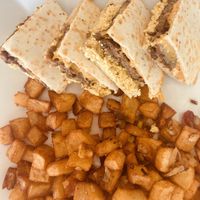 Breakfast Quesadilla & Potatoes  at Simply Green Cafe in Ramsey