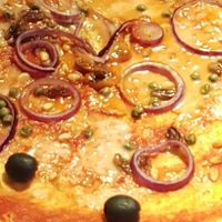 Vegan pizza with olives, onions, capers and raisins at Pizza Express - Cardiff Bay in Cardiff