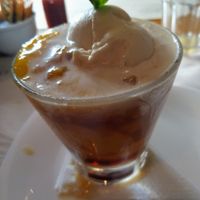 Dessert of the day, with mango sorbet, mango pieces, some sort of alcohol shot, and ice cream. at Camaraderia Gastrobar in Belo Horizonte