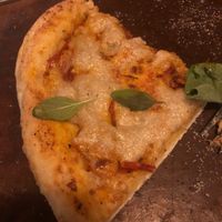 Pizza but I ate most of it before photo because it’s too delicious, pizza tomato and cashew sauce  at Sarinbuana Eco Lodge Restaurant in Tabanan