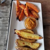 Potatoes and sweet potatoes with salsa brava at Tarifa EcoCenter in Tarifa