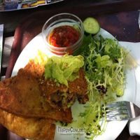 Spicy black bean burger with guacamole and chips at Hendersons at St. John's in Edinburgh