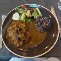 Photo doesn't do the taste any justice. Seitan wild mushrooms and risotto. The side salad was also delectable. at Lusitania in Alvor