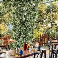 beautiful surroundings add to the warm welcome  at New Mill Tavern in Palairos
