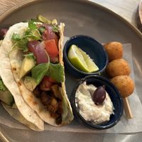 Tacos with BBQ ”meat”, avocado, salad and rice cheddar croquettes  at Happy Bean in Prague