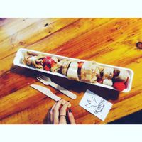 Vegan pancake filled with fresh strawberries and drizzled with maple syrup at The Happy Pig Pancake Shop in Amsterdam