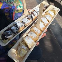 Vegam pancakes filled with banana. One with chocolate sauce, the other lemon and sugar at The Happy Pig Pancake Shop in Amsterdam