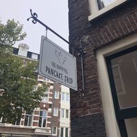 Outside  at The Happy Pig Pancake Shop in Amsterdam
