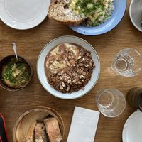 Egg, humus, sourdough bread, granola.  at Epoca Porto in Porto