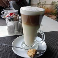 Soy milk latte with vegan biscuit. at The Secret Garden in Benoni