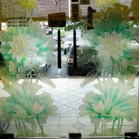 Looking out, hours on door. at Thank Food Vegetarian in Kuching