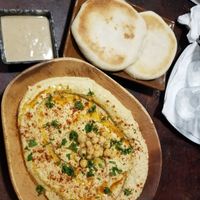 Hummus with pita and tahini at Hayahay Cafe in Mambajao