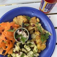 Crushed baked potatoes with cauliflower salad and pickled carrots  at Cafe Nyfiket in Raettvik