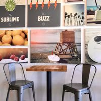 A few tables and counter seating inside at Nekter Juice Bar in Temecula