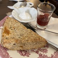Gluten free scone with coconut cream and jam. A standout!   at The Tea Lounge in London