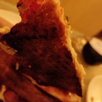 Burned pizza and almost no bacon on the carborana pizza after waiting over half an hour at Masa Madre in Madrid