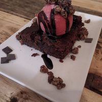 Vegan Brownie with ice-cream and choc sauce at Masa Madre in Madrid