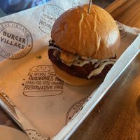 Veggie burger with the spicy vegan topping   at Burger Village in Hicksville