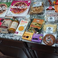 The character limit is too low to detail all items. It is assorted groceries of snacks, frozen items, sweet treats, and a drink to quickly summarize. at Food Fight Vegan Grocery - Halsey St in Portland