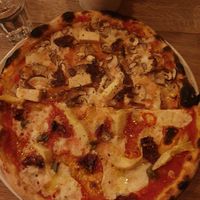 Half a salty and half a I think smoky pizza at The Flat in Exeter