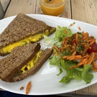 Vegan cheddar tosti met ananas en kleine salade   at Logica Cafe Restaurant in Leiden