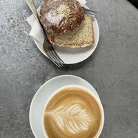 Lemon 🍋 loaf, Breakfast cookie and Latte with oatmilk   at Milano Coffee Roasters - Denman St in Vancouver