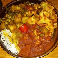 (in a clockwise direction starting with the rice): white rice, lentil dal, baked potatoes with beans, vegan lasagna, sauce with tofu and zucchini at Govinda's - North City in Dublin