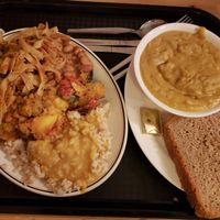 Medium dinner plate (a sampler of the different dishes they had that day, including curry on rice, curried vegetables, baked beans and more) and soup. Everything pictured here is vegan, other than the butter.  at Govinda's - North City in Dublin