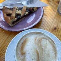 Tarta con mermelada casera. Y decaf con leche de avena.   at Sabores Naturales in Ibiza