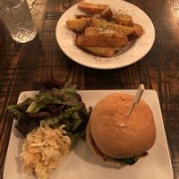 Portobello mushroom burger with salad, slaw and Parmesan chips. at The Tipsy Vegan in Cambridge