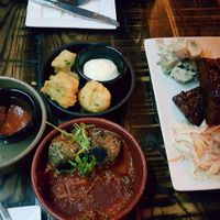 Half eaten - jalapeno poppers at the top, arancini left, meatballs bottom and full rack of ribs at The Tipsy Vegan in Cambridge