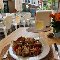 Outdoor seating and a delicious pineapple kombucha at The Sacred in Zurich