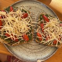 Vegan Toast - pesto, tomato, parmigiana (v) & sunflower seeds at Goldig in Lagos