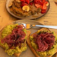 Avocado and red onion on sour dough toast and peanut butter and fruit pancakes . Both delicious   at Goldig in Lagos