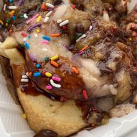 Cinnamon roll with chocolate sauce, chocolate frosting, chocolate chips and sprinkles.  at Cinnaholic in Los Angeles