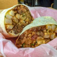 Beans, rice, pico, guacamole, vegan meat and French fries at Chico's in Gunsan